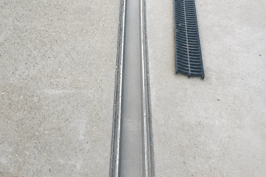 Gutter Sukker - Gutter Cleaning Adelaide home page photo of a strip drain that has been cleaned.